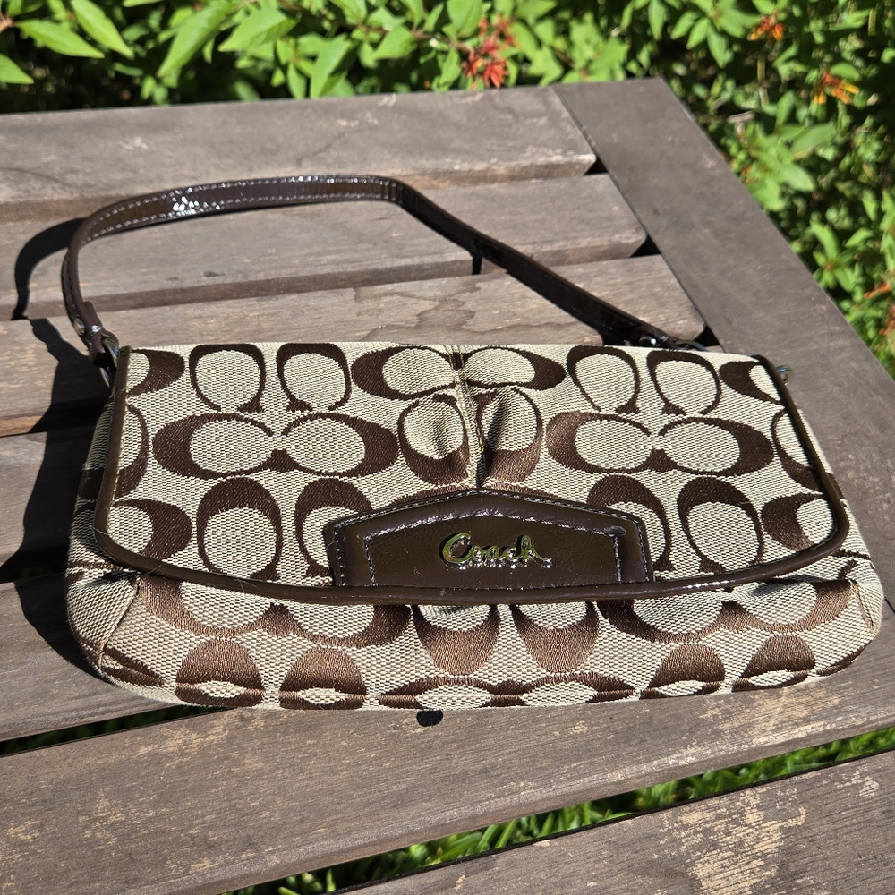Coach classic Monogram clutch 9" X 5"